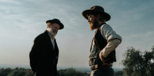 First Look: Johnny Flynn and John C. Reilly Star in Survival Thriller—A Prayer for the Dying Image