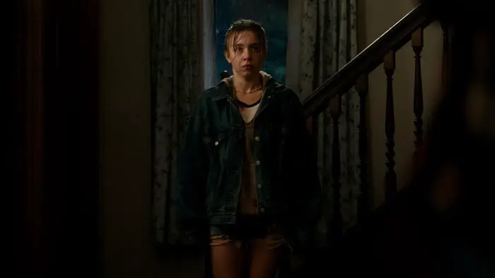 Sydney Sweeney stands tense and rain-soaked in a dramatic scene from Echo Valley