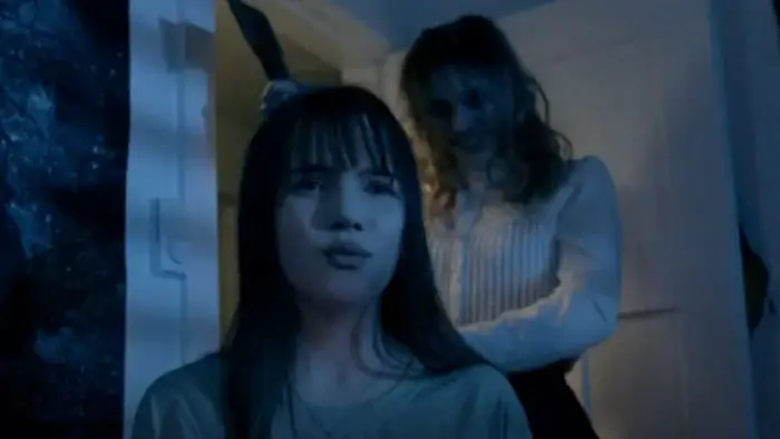 Lizzie Borden stands behind young woman with an axe in The Lizzie Borden Game