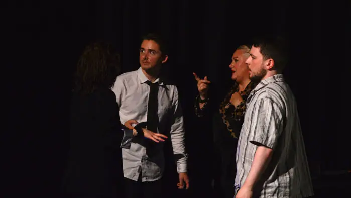 Cast members of Forbidden Catch: An Aquatic Affair performing on stage