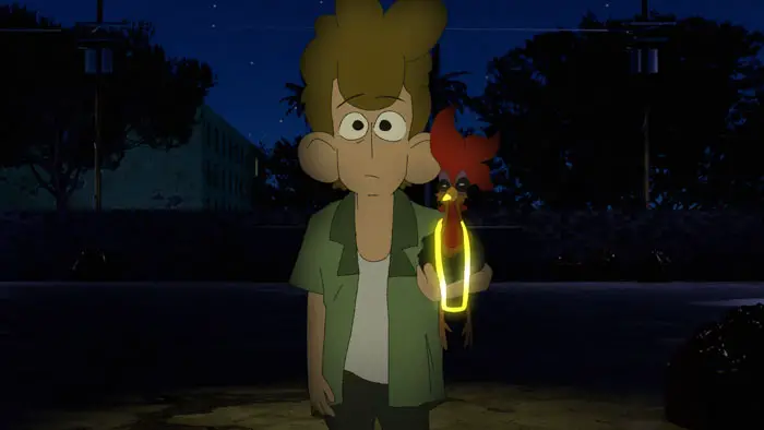 The owner of Yunian the rooster stands in a dimly lit street at night, holding the rooster in his hands.