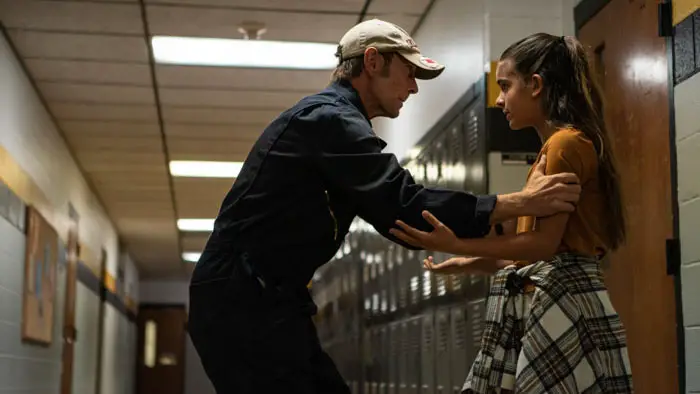 P.J. Sosko as Harold Miller confronts Mia Gonzalez as Violet in a school hallway scene from Just the Janitor.