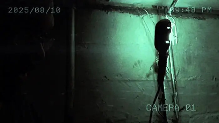 Surveillance-style footage captures the eerie basement in LearX.