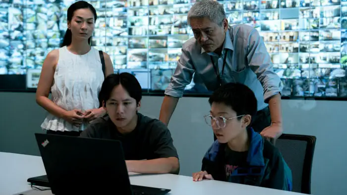 Characters review surveillance footage in Stranger Eyes.