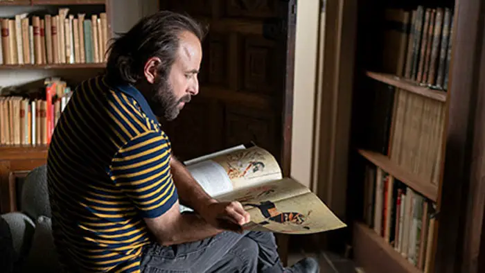 Vincent Macaigne reads a book in Suspended Time.