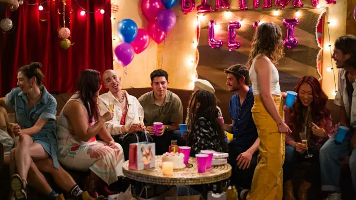 Cast gathered at a party scene in Before the Party