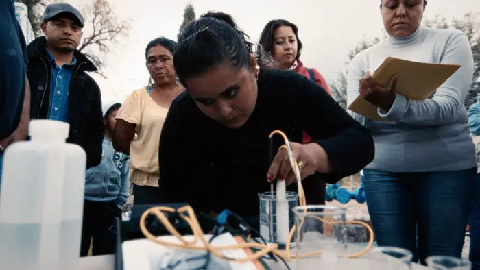 Woman testing water samples in The Age of Water documentary