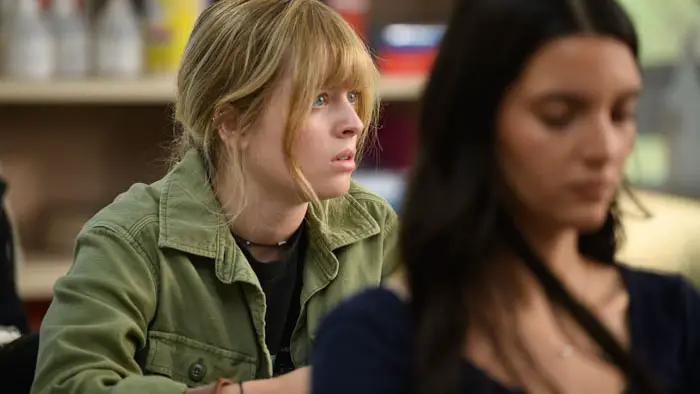 Lulu Wilson as Renee in a classroom scene from Xeno (2025).