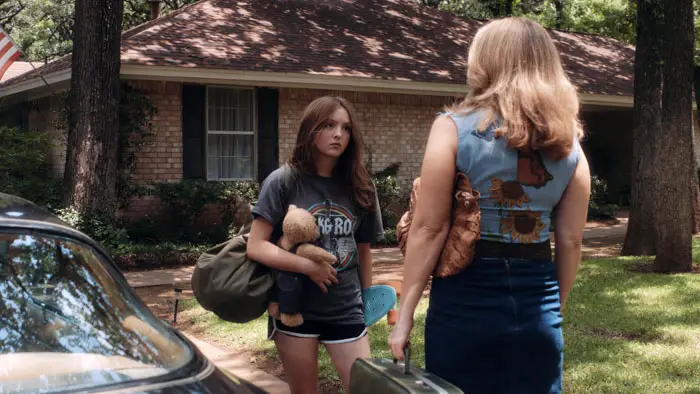 Casey (Presley Richardson) stands with her mother (Arianne Martin) outside a Texas home.