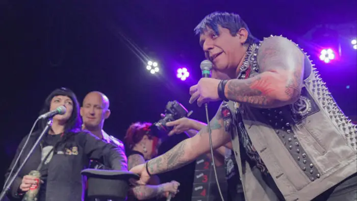 Trae Martinez draws names from a hat onstage during the Punk Rock Lottery event in Austin, Texas.