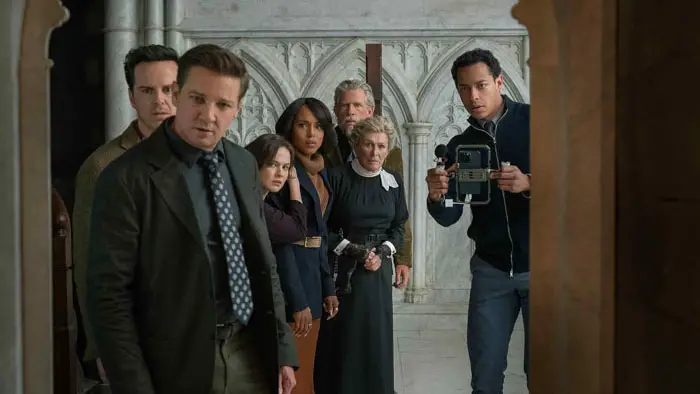 The congregation looks into the church chamber in Wake Up Dead Man: A Knives Out Mystery.