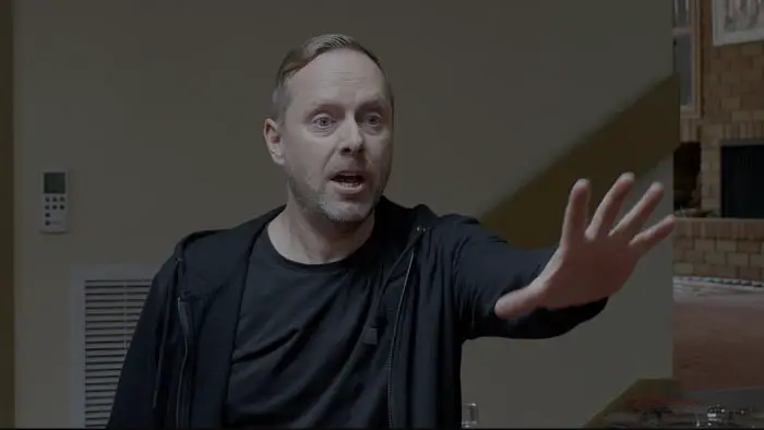 Nathan Hill as Steve reaching out in a tense moment in Bitter Desire