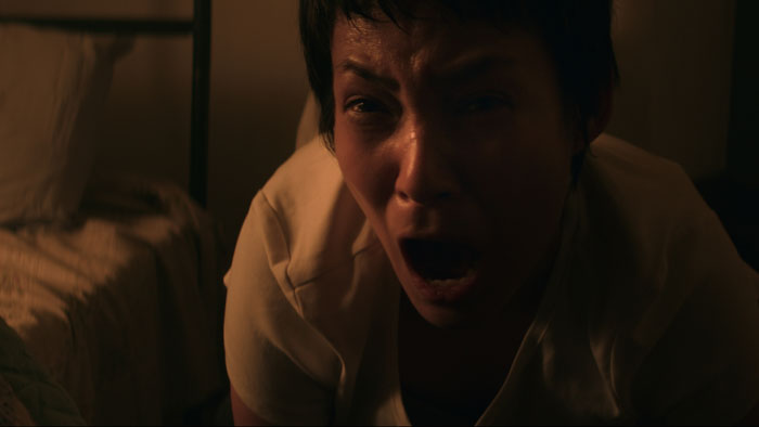 April screams in terror as she faces a demonic presence in For God’s Sake Wake Her Up 