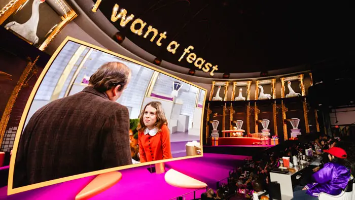 Veruca Salt demanding a goose that lays golden eggs inside COSM’s immersive Shared Reality dome.