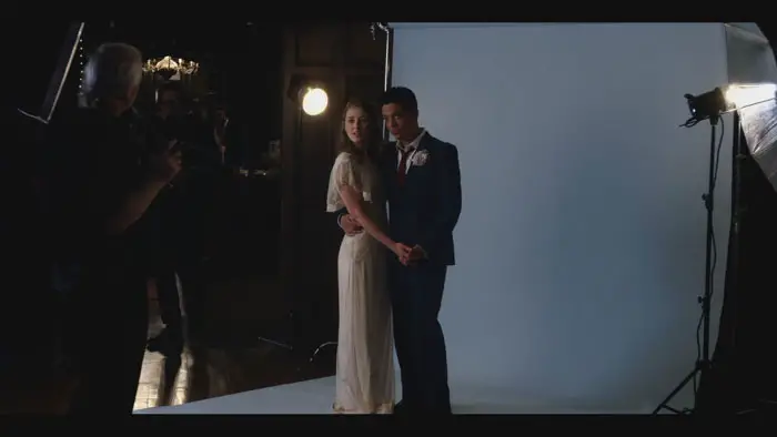 Shane (Rigo Garay) and Leah (Ella Rae Peck) pose for wedding photos in Crumb Catcher (2025).