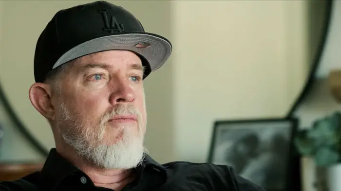 Director Erik Thureson in an interview setting wearing a black LA hat.