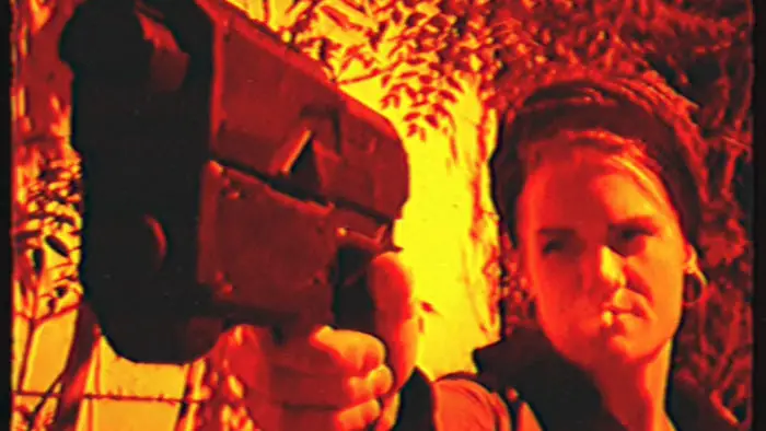 A survivor aims a handgun in the post-apocalyptic short film 2025: Steel City Warriors.