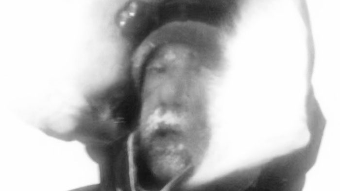 A bundled musher covered in frost during a brutal Alaskan storm in Without Warning.