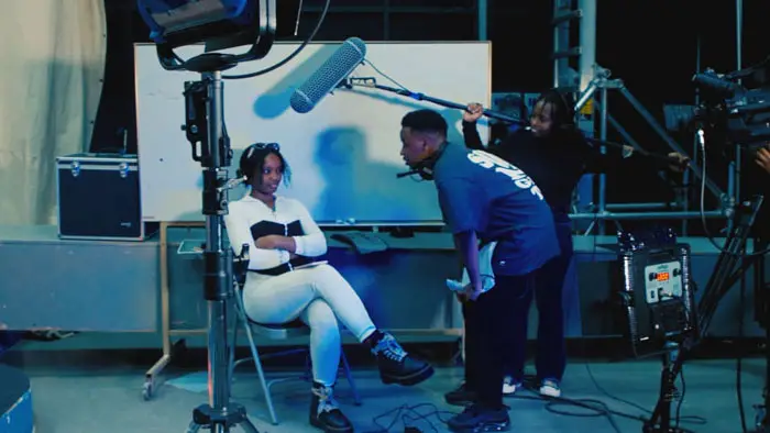 Film crew recording a scene on set in Behind the Behind the Scenes (2026) directed by James Ongige