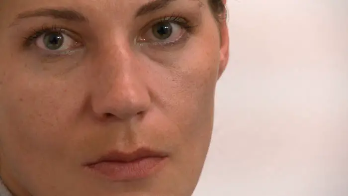 Close-up interview portrait of Olga in the documentary Holy Ghetto (2026).
