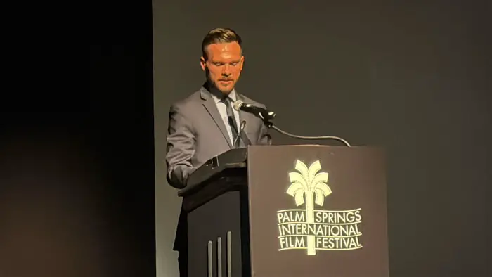 Reid D. Milanovich speaks at the Palm Springs International Film Festival opening night podium.