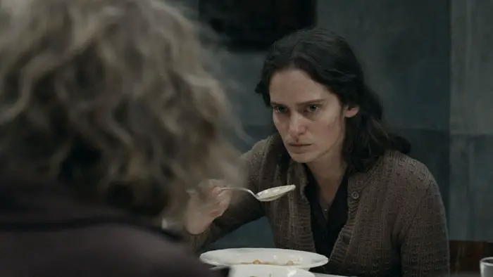 Rosa Sauer cautiously tastes food under Nazi supervision in The Tasters (2026)