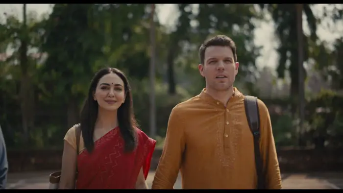 Andrew and Daniela walk together in India in A Mosquito in the Ear (2026).