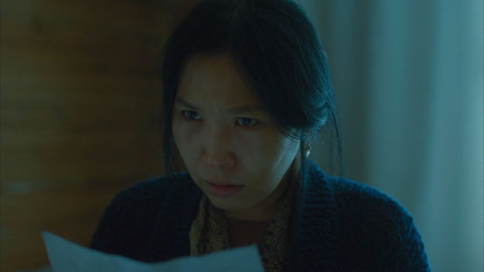 Aytalina Yakovleva as Aita reading a note in Stepan Burnashev’s Yakuti thriller Aita (2022)