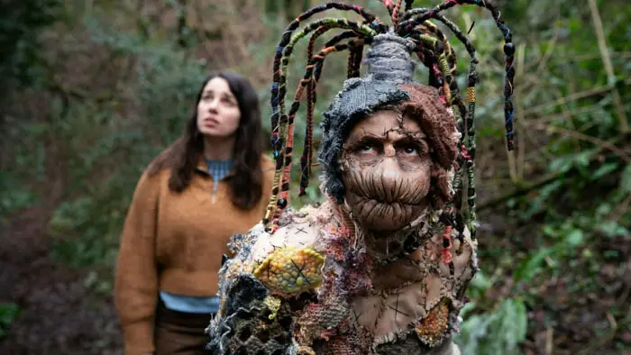 Patches creature with stitched fabric costume and sewn lips in Gale Yellow Brick Road