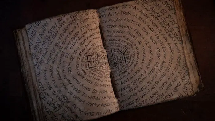 Sketchbook page repeating the phrase Stay Away From Oz in Gale Yellow Brick Road