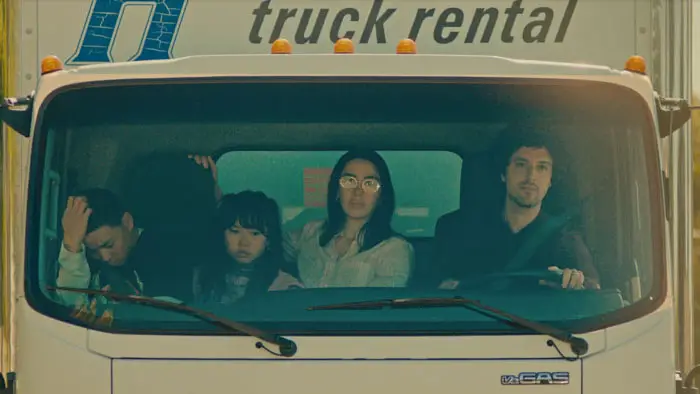 The family rides in a U-Haul truck in a scene from Fil-Am (2026).