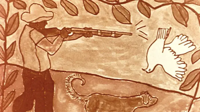 Archival black-and-white close-up of Paulo Freire speaking in an interview featured in Reading the World documentary.