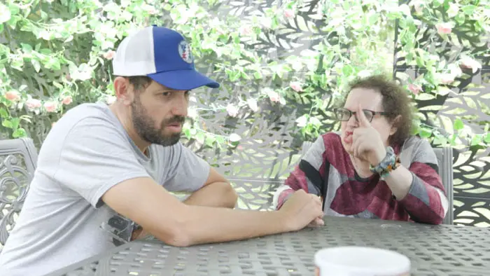 Matt Nagin and Bonnie Schneider in an outdoor argument scene from Sorry Mom (2026)