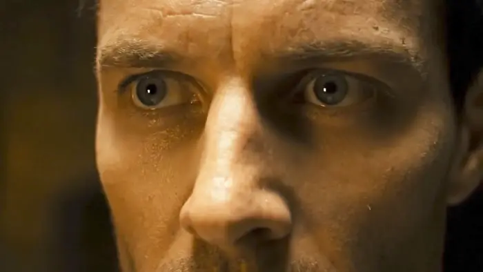 Extreme close-up of the treasure hunter’s face in The Last Emerald (2026).