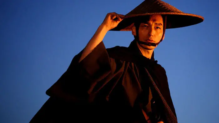 Kakunoshin Yanagida (Tsuyoshi Kusanagi) stands in traditional samurai attire in Bushido.