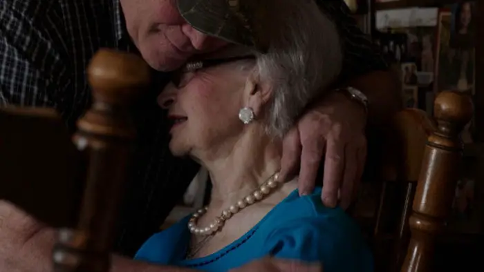 Beverly LeMieur embraces a family member in The LeMieurs.

