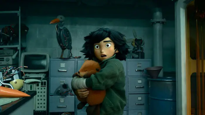 Mabel Tanaka holding a robotic beaver in a laboratory scene from Pixar’s animated film Hoppers.